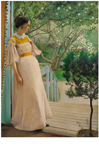 Woman in a dress on a porch, looking at a garden.