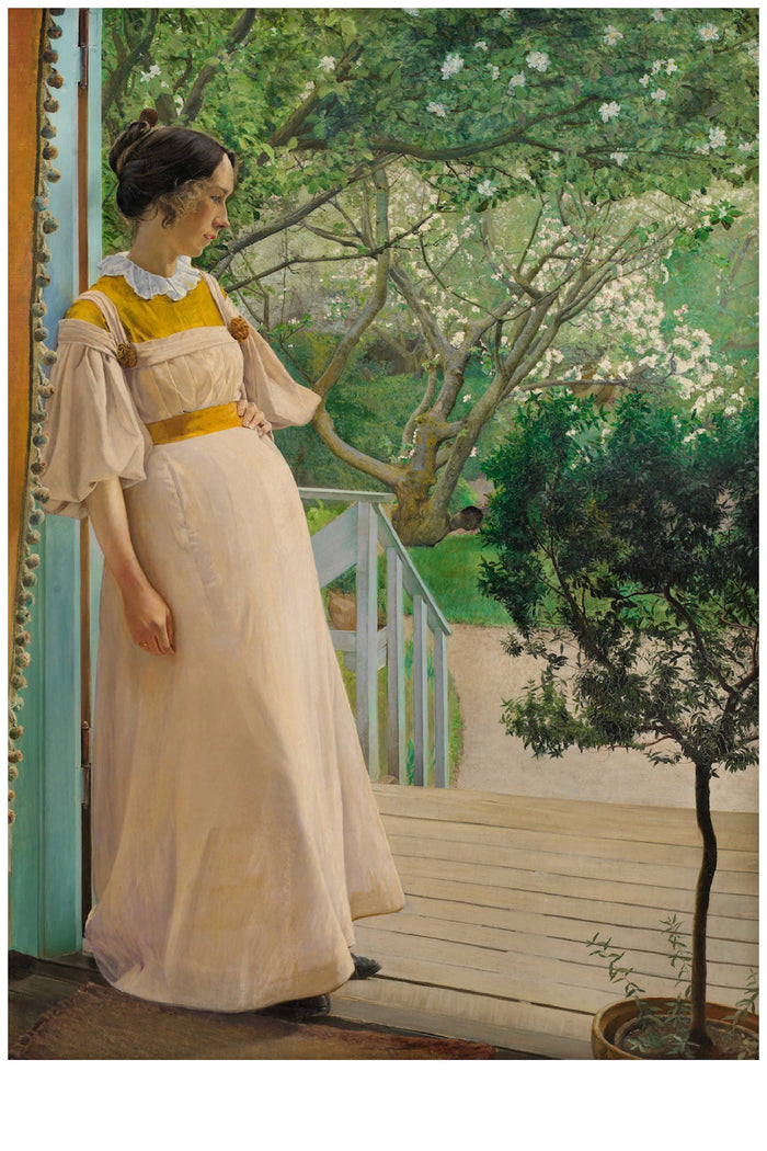Woman in a dress on a porch, looking at a garden.