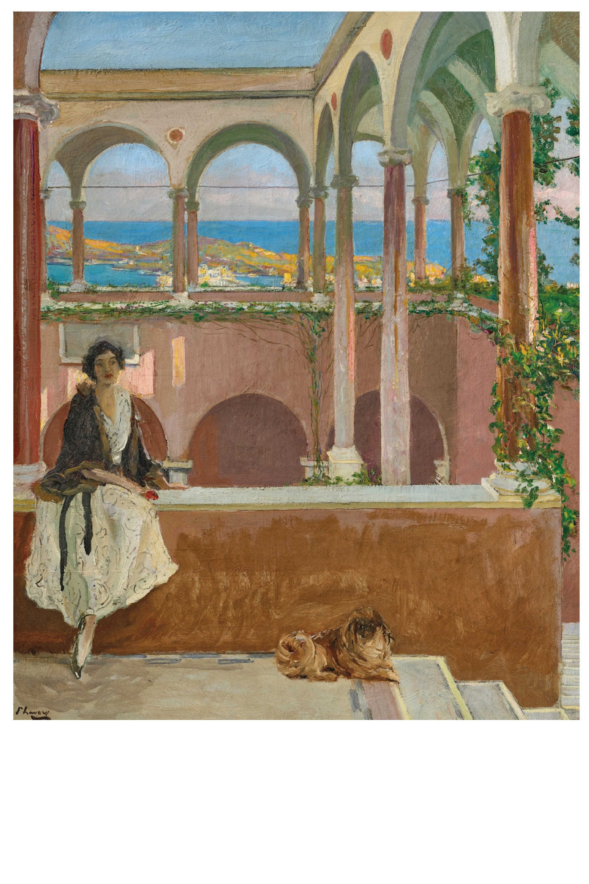 Woman seated on a terrace overlooking a coastal view.