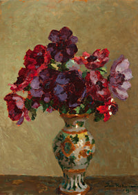 Vase of red and purple flowers.