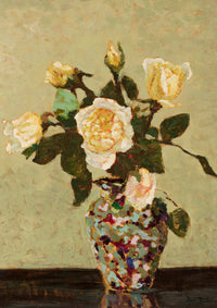 Vase of yellow and white roses.