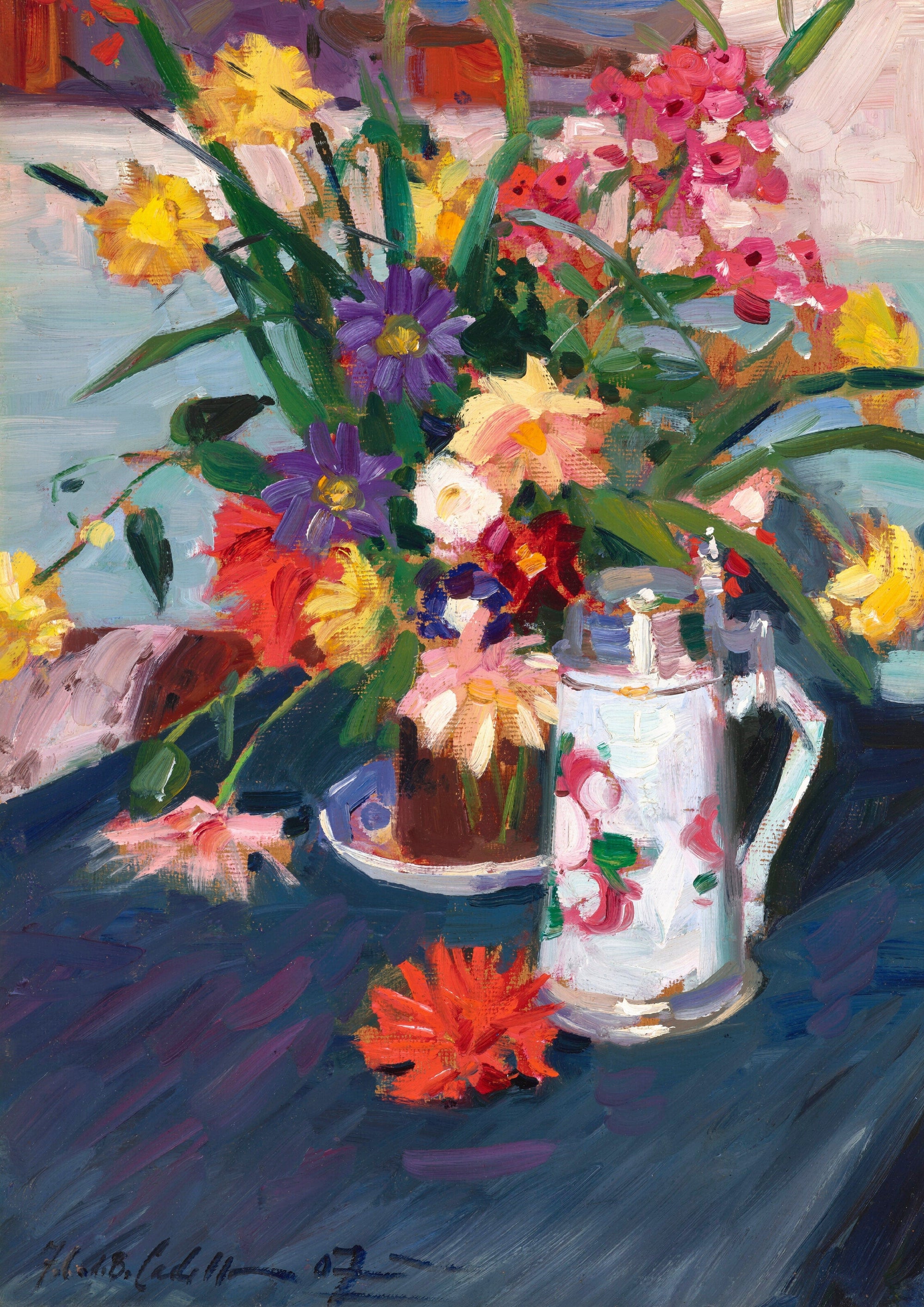 Vase of colorful flowers with a decorated pitcher on a blue table.