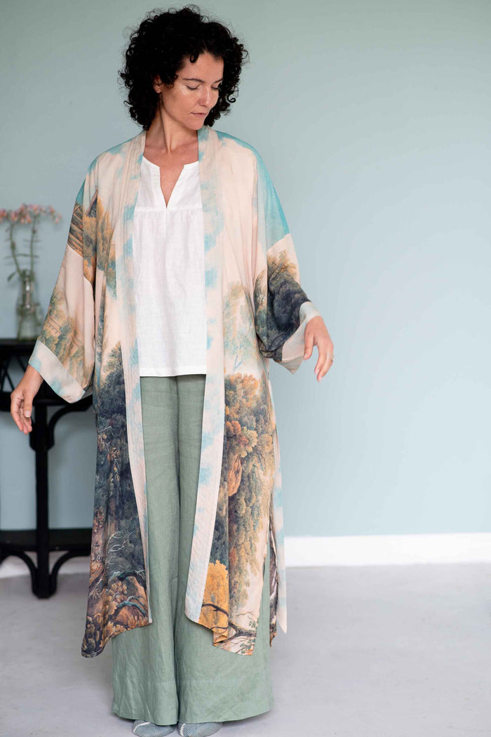 Woman in Awakening Opera Duster Julia White & Ollie Green Outfit