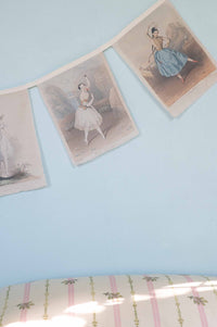 Ballerina garland on blue wall