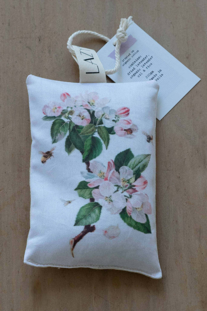 Bee sachet with floral print and flying bees.