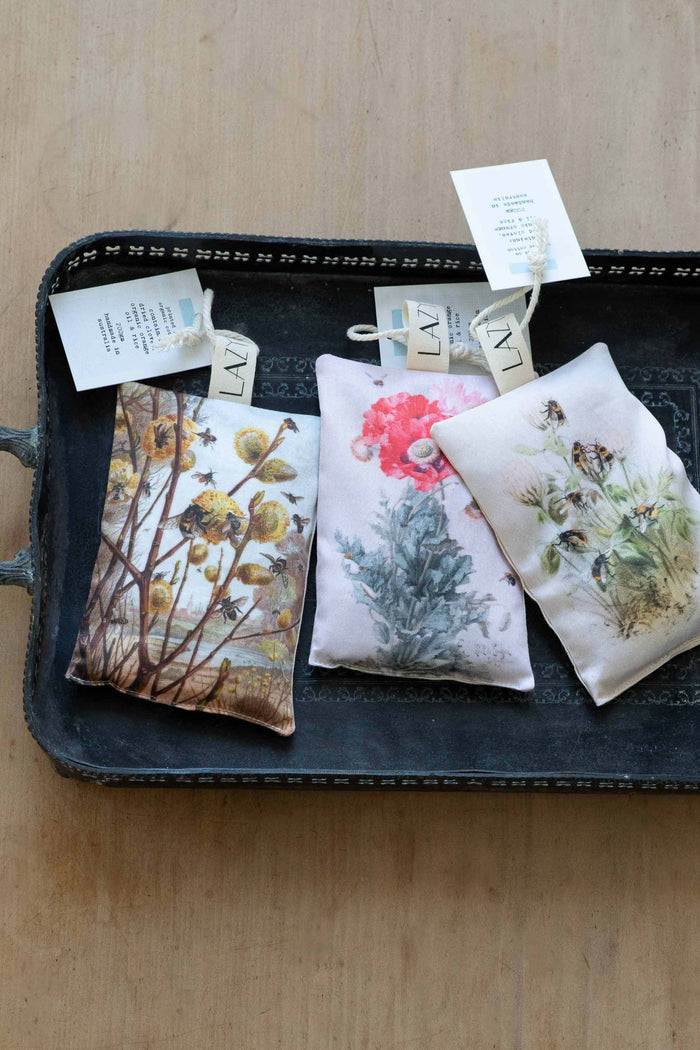 Orange bee sachet with floral design on tray.
