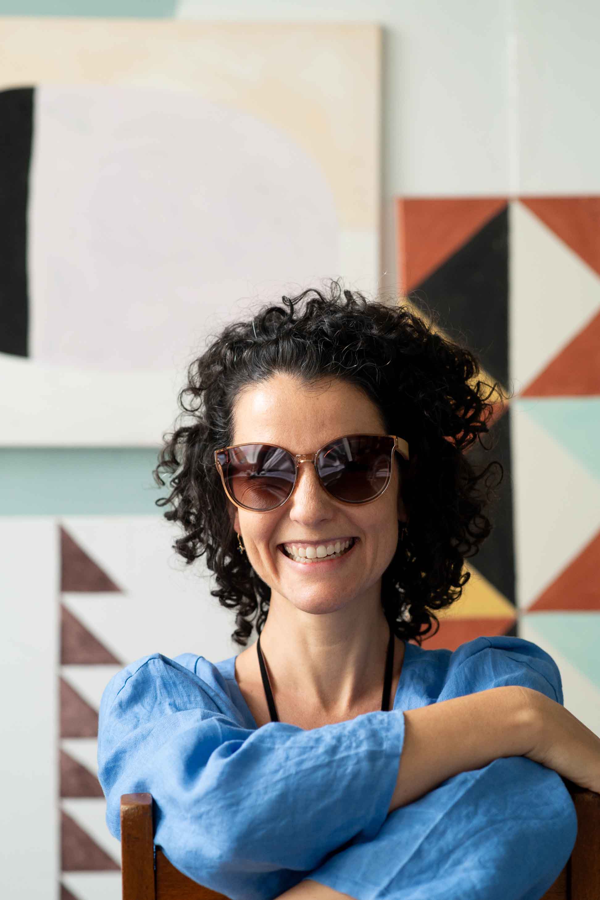 Bella Champagne smiling with sunglasses, Fara Clouds