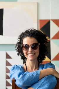 Bella Champagne smiling with sunglasses, Fara Clouds
