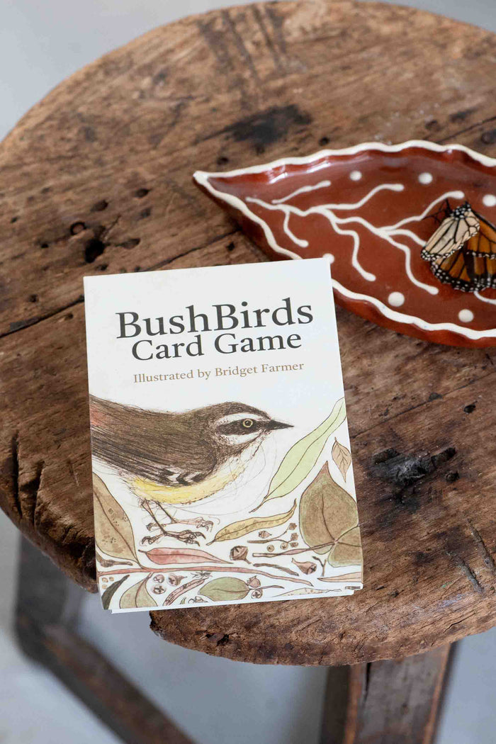 BushBirds card game on wooden stool