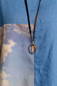 Crystal Locket Oval Necklace on Blue Fabric