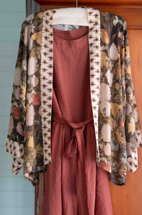 Floral kimono jacket over rust-colored dress