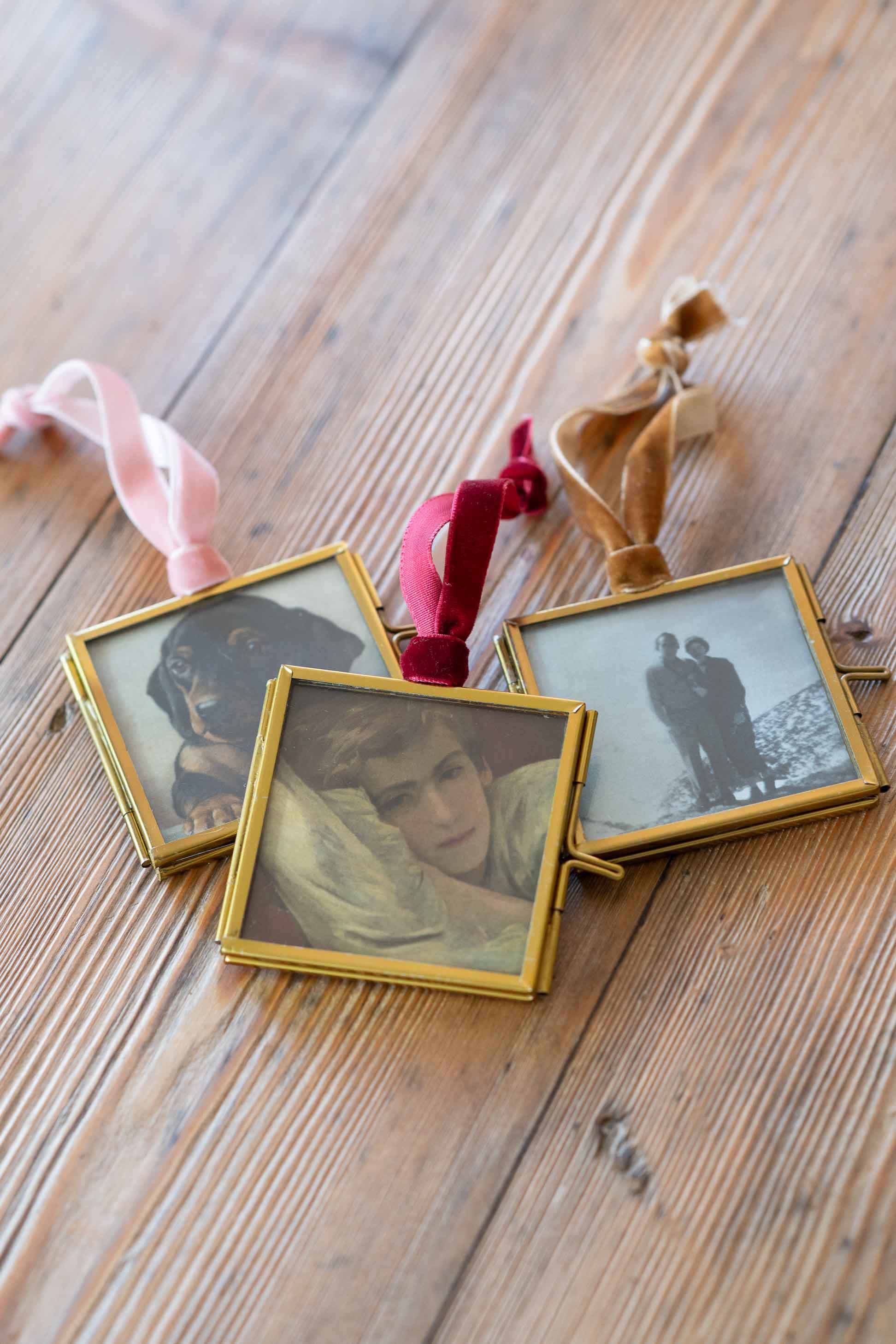 Photo ornaments with various images on wood surface