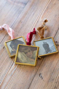 Photo ornaments with various images on wood surface