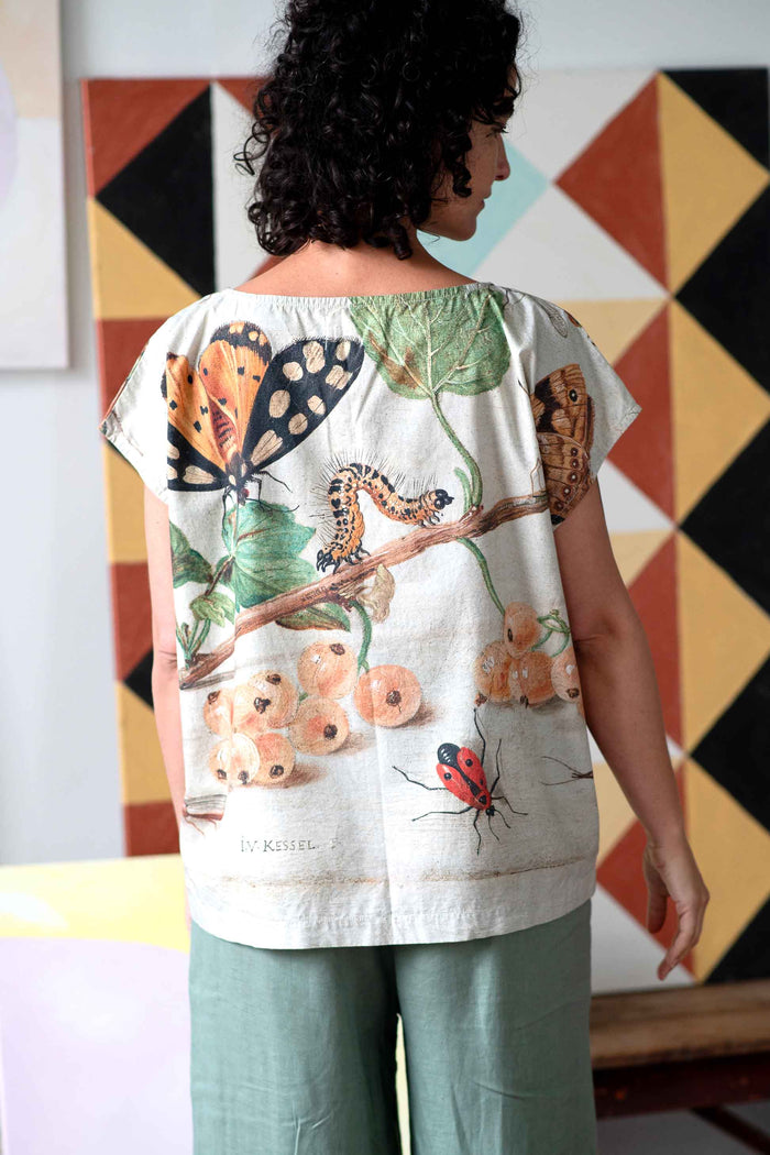 Eleanor Insects shirt with butterfly, caterpillar, and ladybug