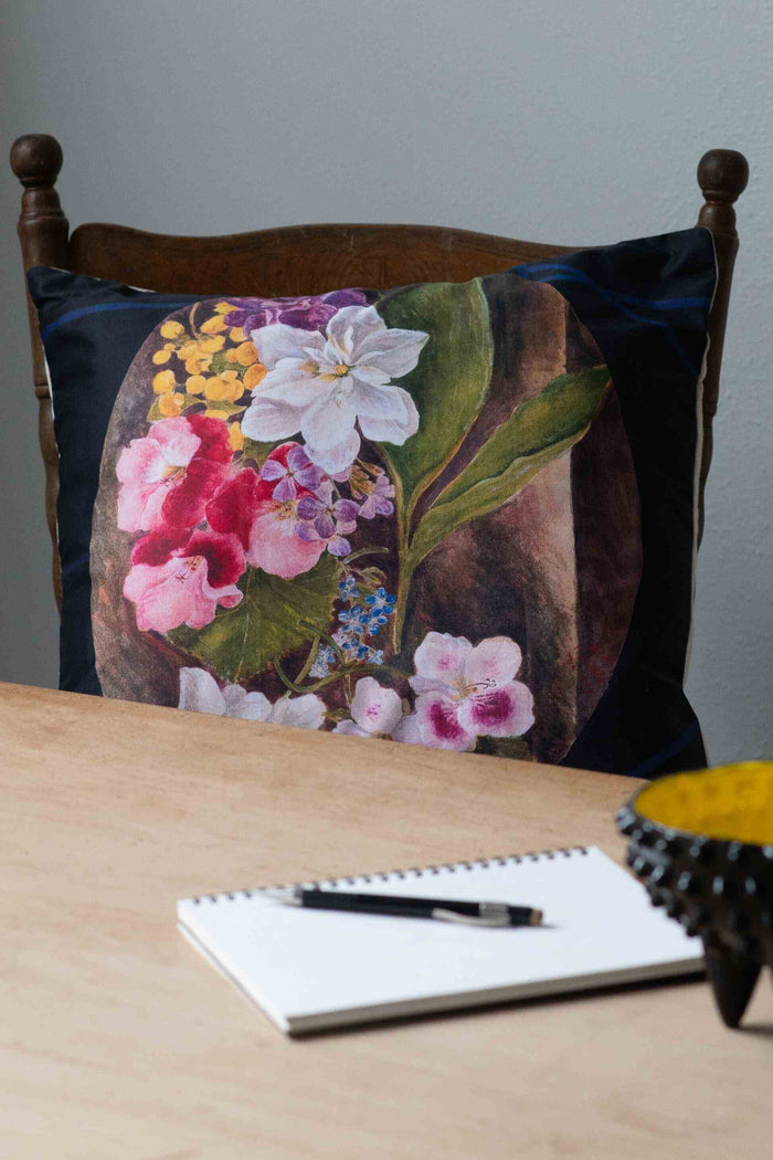 Flower study cushion with floral design on chair