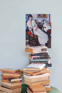 Girl in white painting above stacked books.