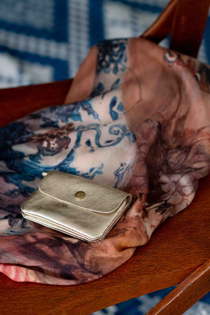 Gold purse and scarf detail