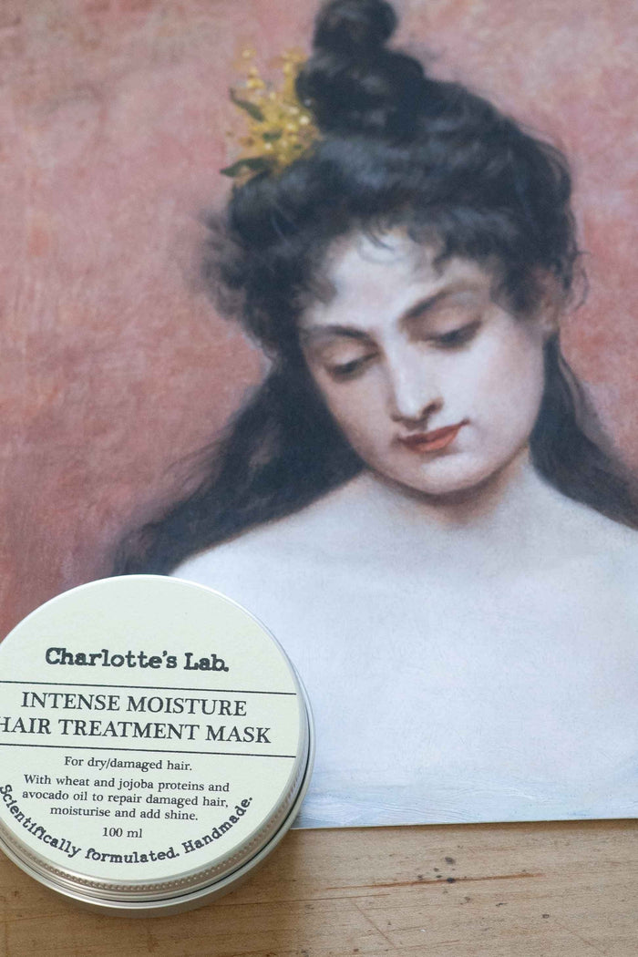 Charlotte's Lab Intense Moisture Hair Treatment Mask on vintage portrait.