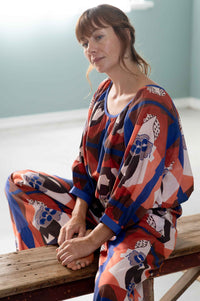 Woman in patterned top and pants from HettiTopCompositionOllieComposition