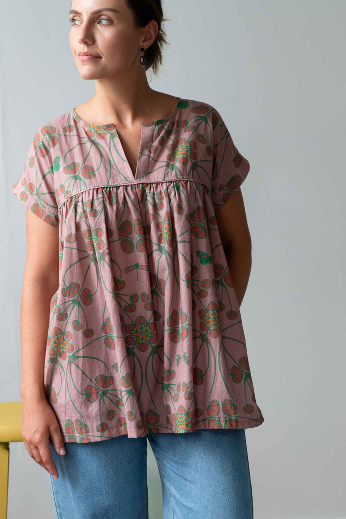 JuliaTerraLucyJeans model wearing a floral top and jeans.