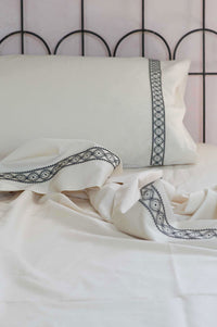 Cream-colored embroidered sheet set