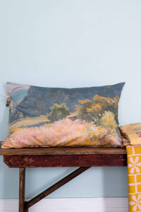 Landscape pillow on bench