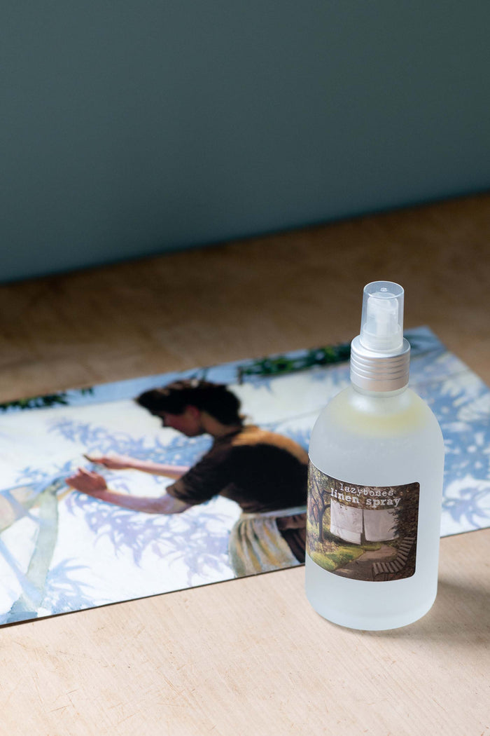 Lemongrass linen spray bottle with vintage art background