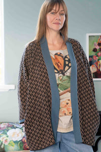 Eleanor in Lola Cardigan with insect print top and denim.