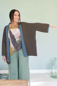 Woman in Lola Cardigan, Peggy Garden, Ollie Sage outfit