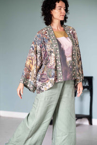 Woman in Love Grows Wild floral kimono and green pants.