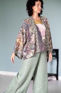 Woman in Love Grows Wild floral kimono and green pants.