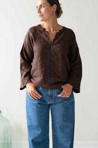 Woman in Marli Chicory Nico Jeans, brown top and jeans