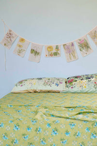 Matilda Smith Avonlea floral garland over busy garden bed