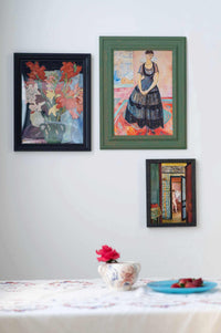 Miss SC artwork display with paintings and flowers