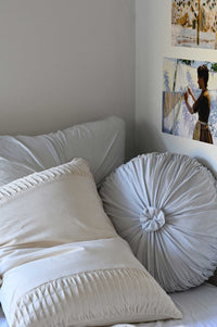 Dove euro cushion and natural pillowcase on bed