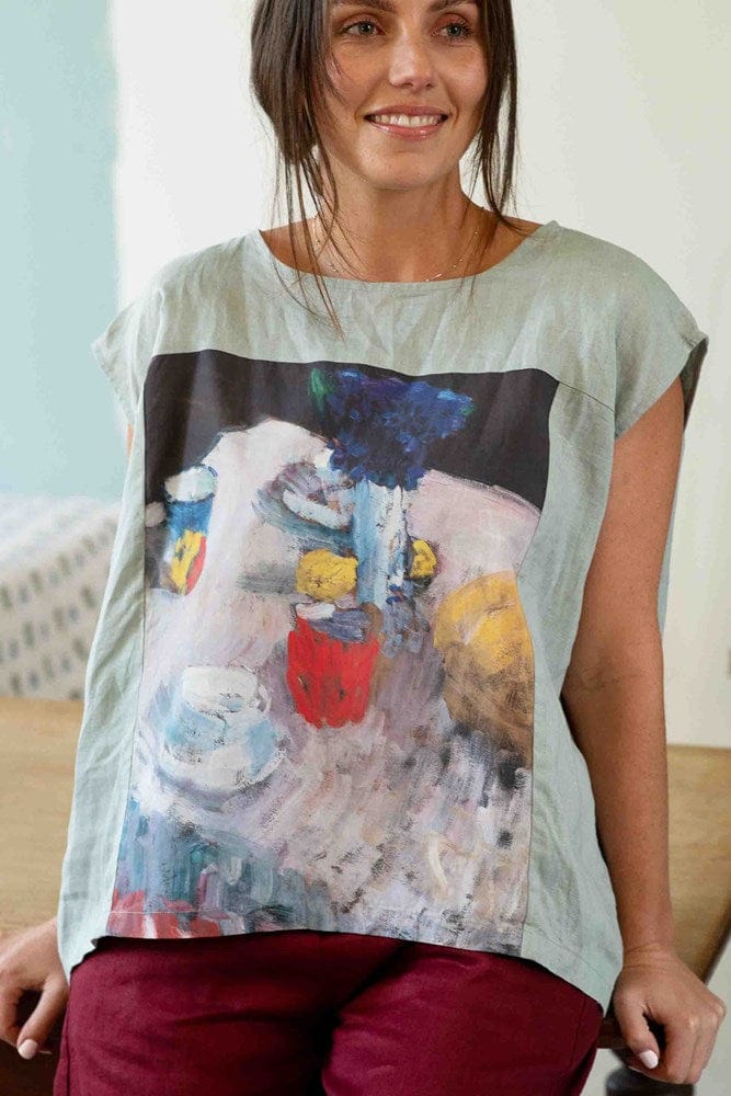 Woman wearing Peggy Still Life Ollie Red top