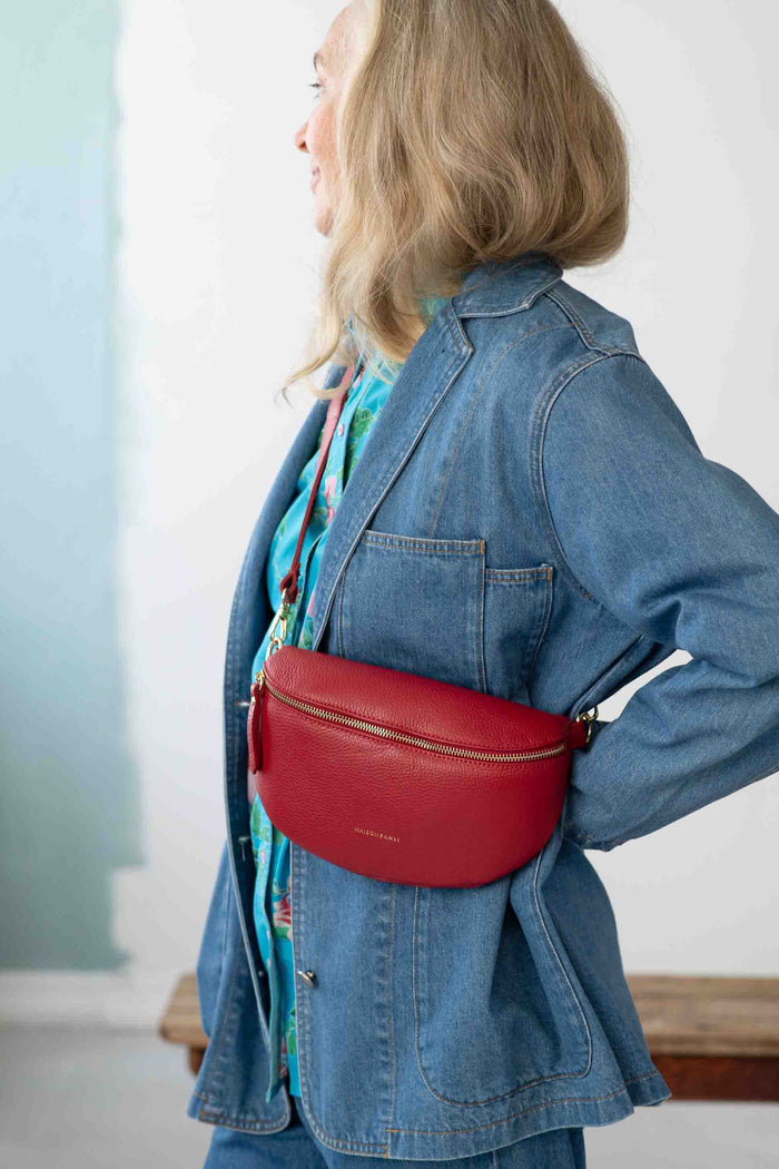 Woman in Dinah Jacket with Rouge Crossbody Bag