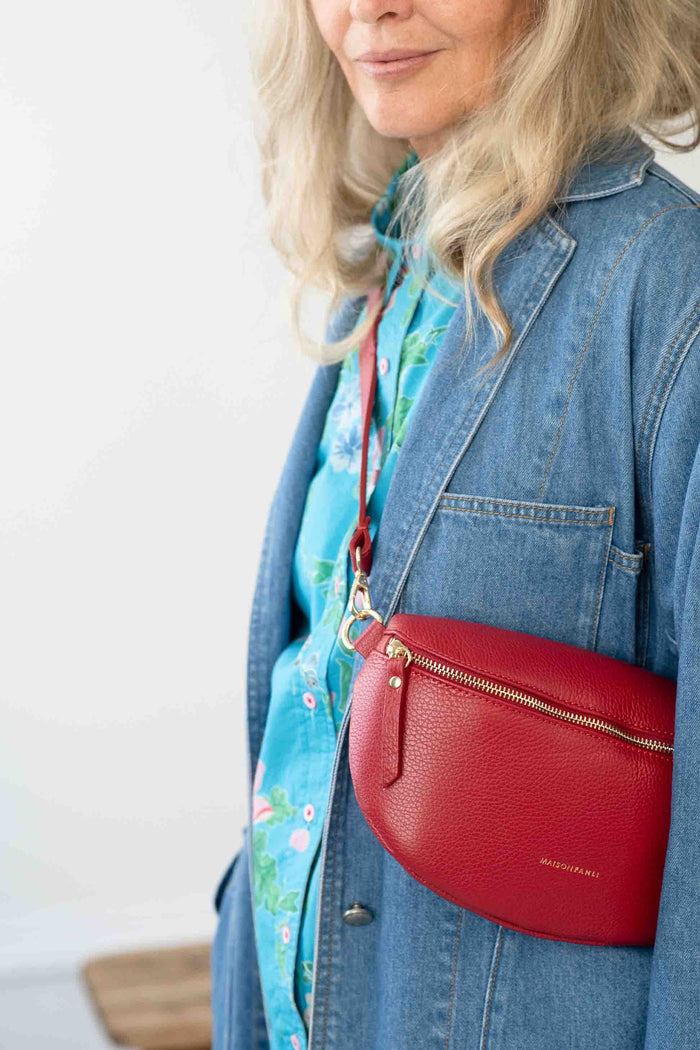 Woman wearing Rouge crossbody bag & Dinah Jacket