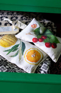 Scented sachets with citrus and cherry designs