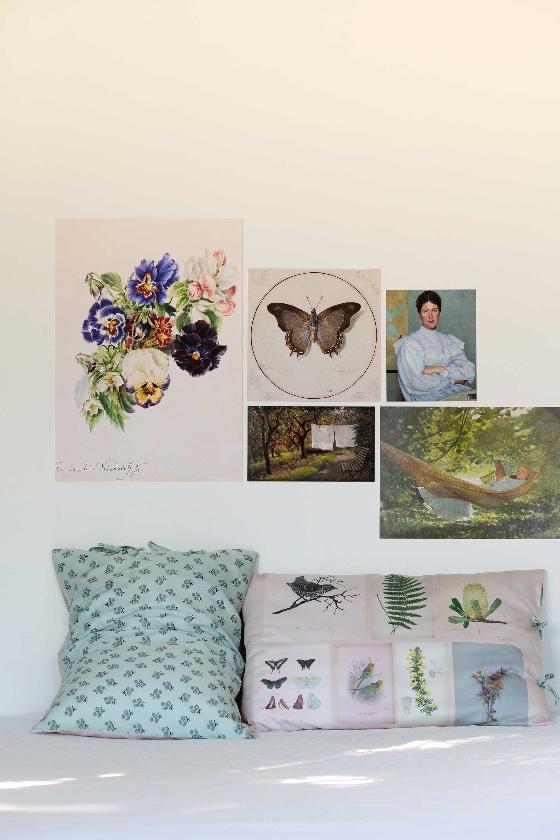 Scrapbook pillowcase set with art prints of flowers, butterflies, & landscapes.