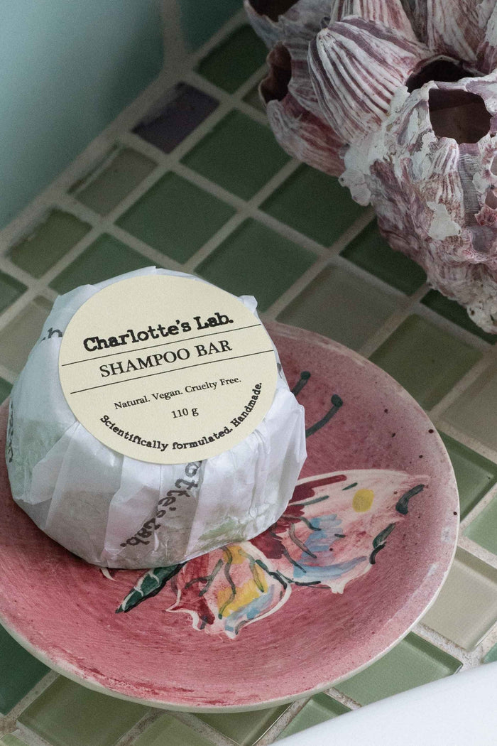 Charlotte's Lab Shampoo Bar on pink dish
