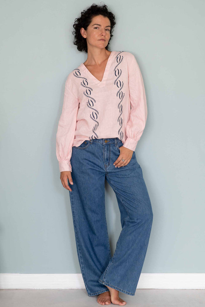 Simona Tearose Nico Jeans, woman in pink top and denim jeans