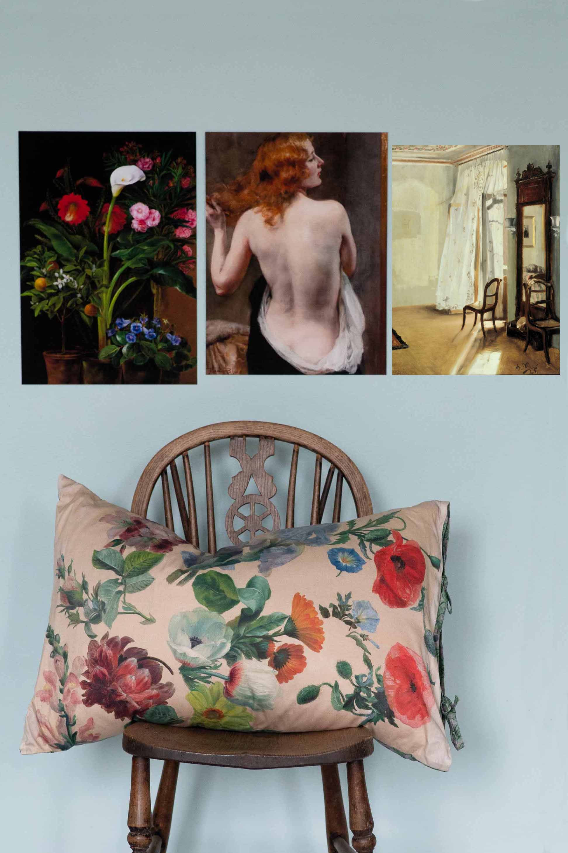 Floral pillow and art on wall.