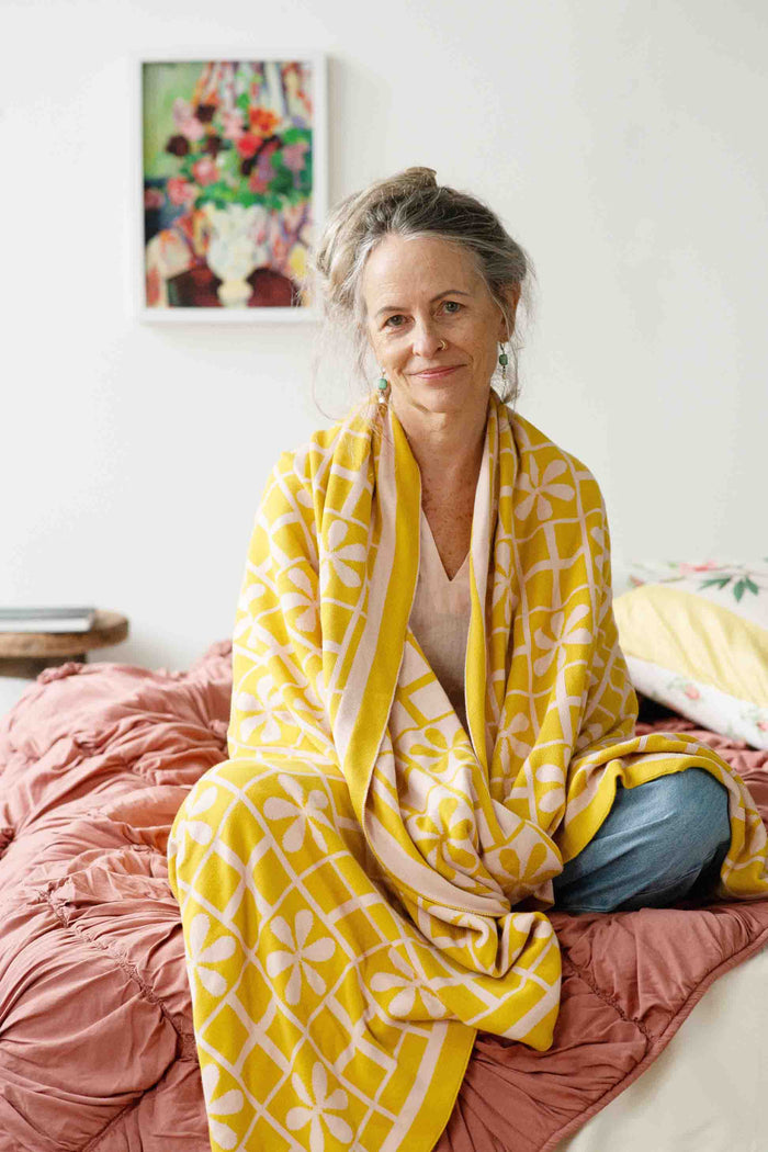 Simona in yellow floral throw blanket