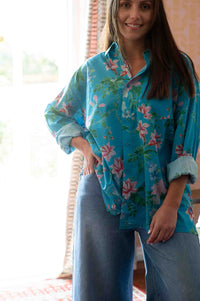 Ted Bluesette in floral shirt and denim jeans