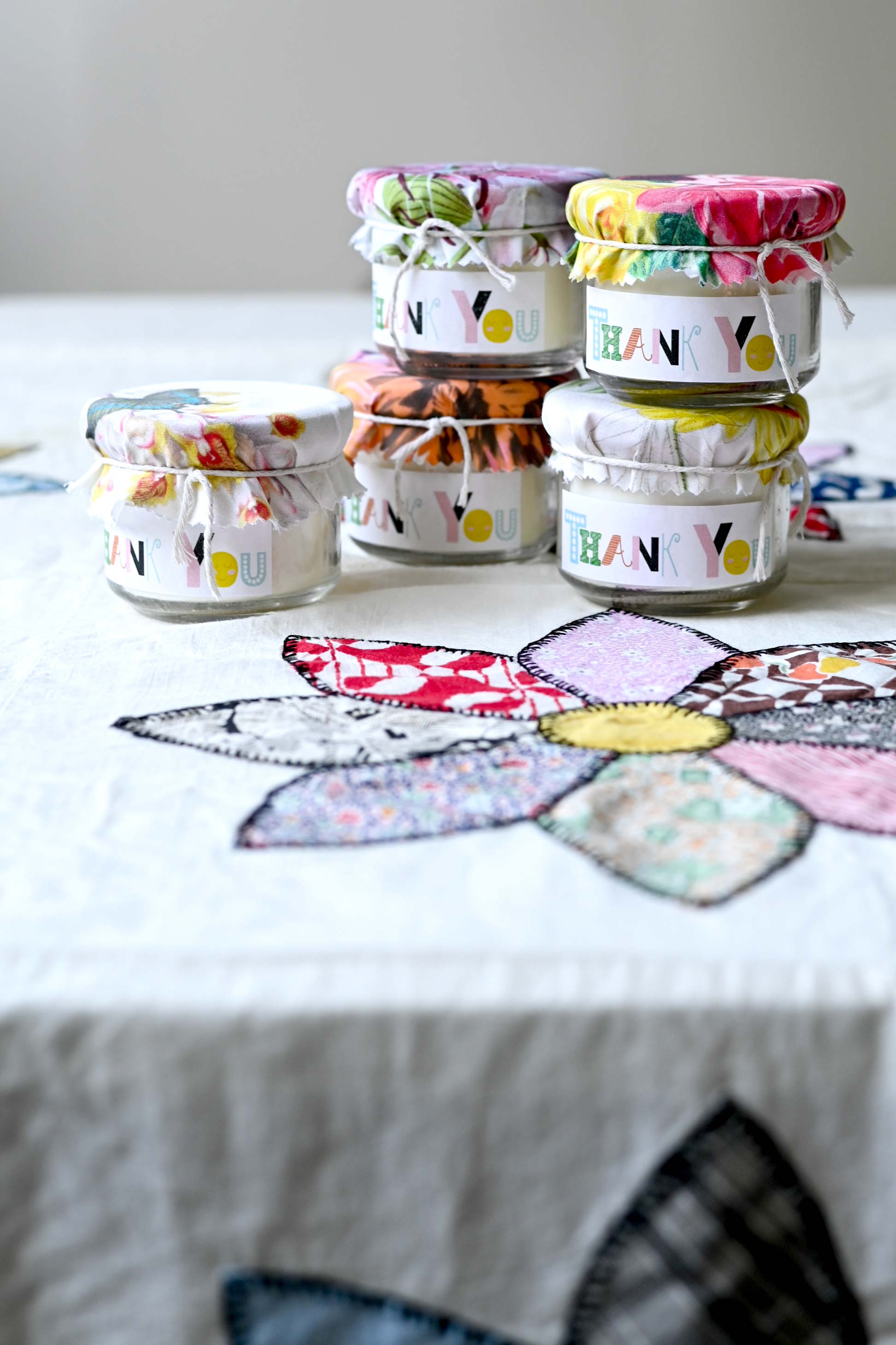 Thank you candles on floral tablecloth
