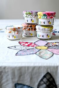 Thank you candles on floral tablecloth