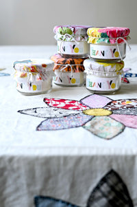 Thank you candles on floral tablecloth