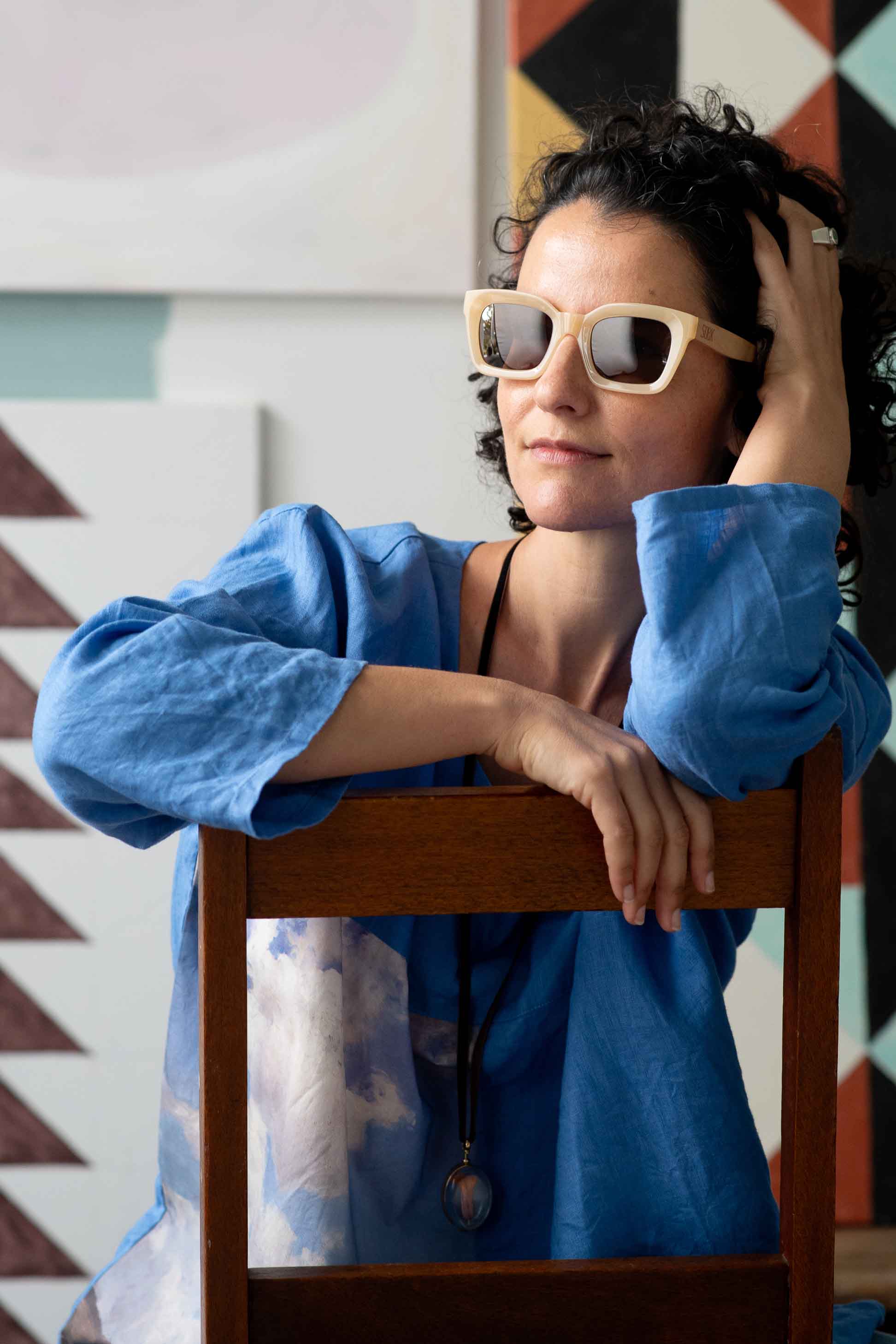 Zahra wearing sunglasses, posing in front of clouds, DSC1208
