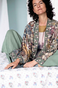 Peggy in green kimono in garden setting